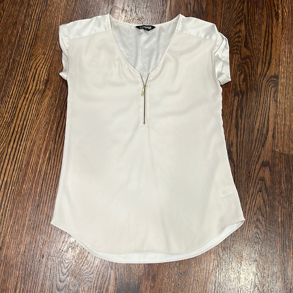 Express champagne top with gold zipper